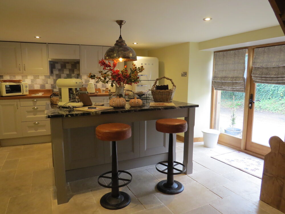 Cream kitchen with Aga and marble island